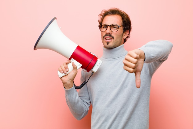 Young handsome man with a megaphone