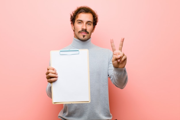 Young handsome man with a sheet of paper