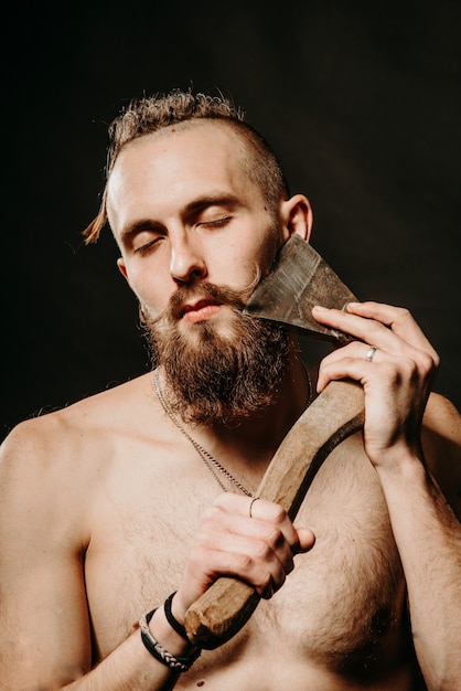 Young handsome man with a thick beard and large mustache