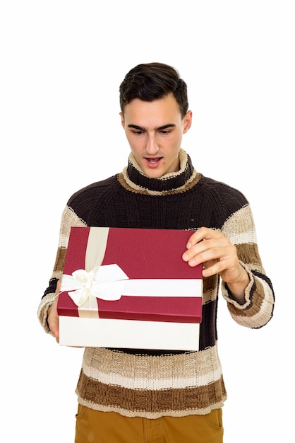 young handsome man with turtleneck sweater ready for winter isolated on white