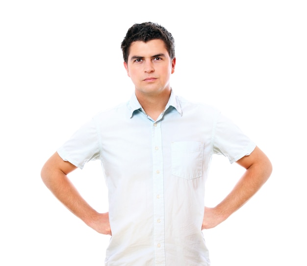 a young handsome serious man standing over white background