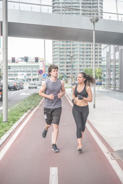 young handsome sportive man and woman running