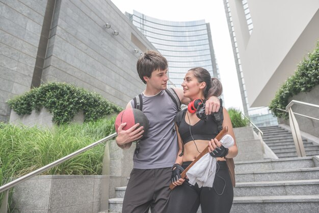 young handsome sportive man and woman walking