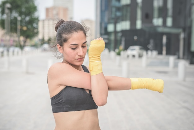 young handsome sportive woman boxer