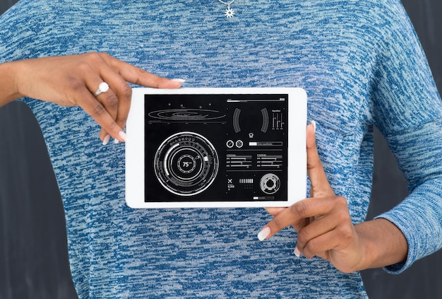 Young Happy African American Woman Using Digital Tablet  Isolated on a gray background