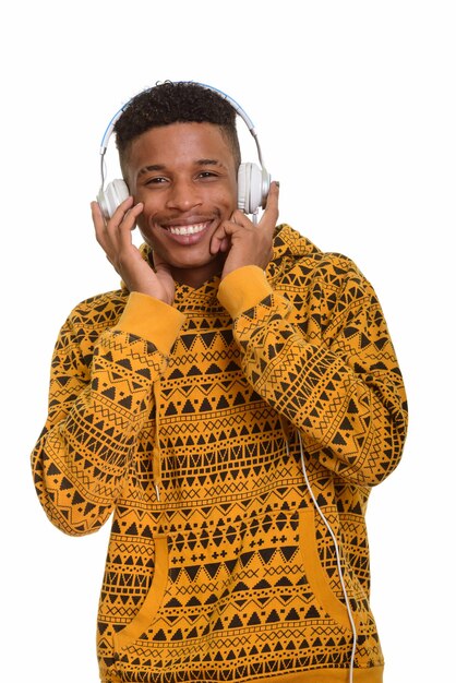 Young happy African man listening to music