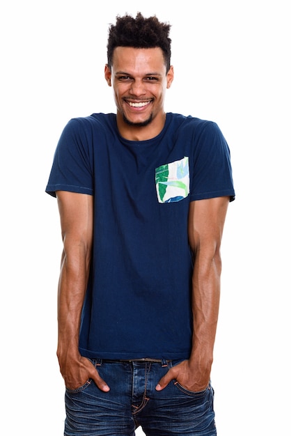 young happy African man smiling and laughing with hands on pockets
