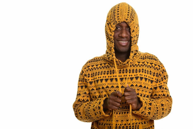 Young happy African man smiling and playing with hoodie