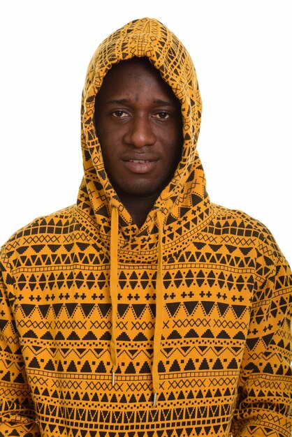 Young happy African man smiling and wearing hoodie