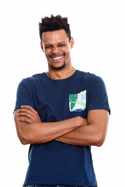 young happy African man smiling with arms crossed and eyes closed