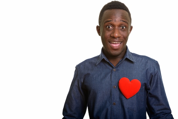 Young happy African man smiling with red heart on chest