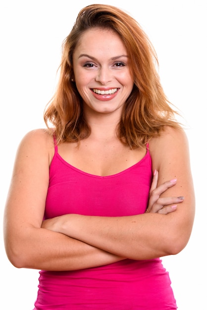 young happy Brazilian woman smiling with arms crossed