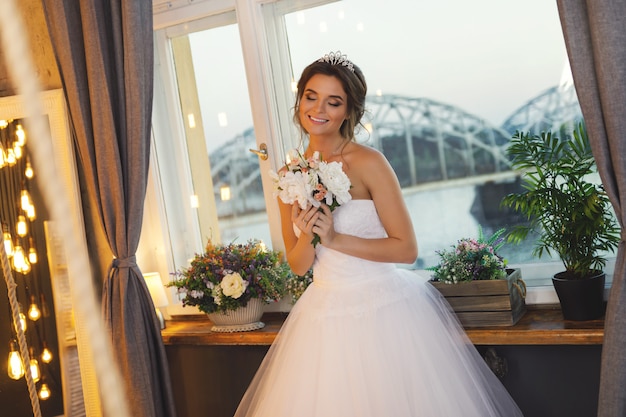 Young happy bride wearing beautiful lush dress