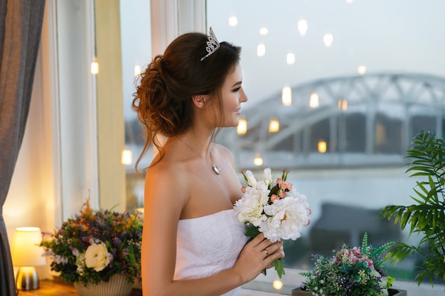 Young happy bride wearing beautiful lush dress