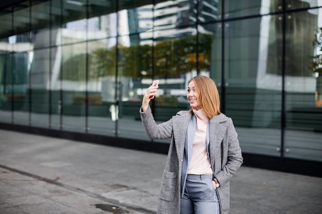 Young happy business woman using video call.