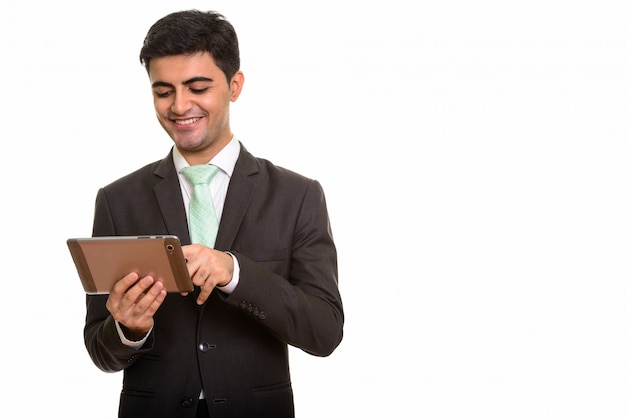 Young happy businessman using digital tablet