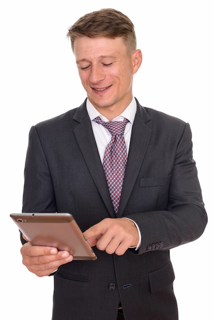 young happy businessman using digital tablet