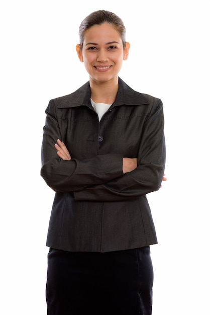 young happy businesswoman smiling and standing with arms crossed