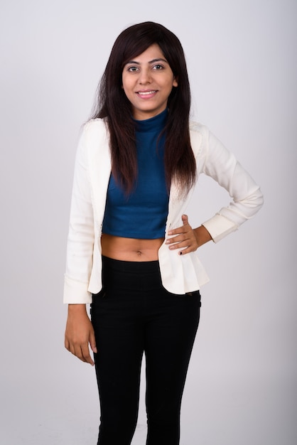 Young happy businesswoman smiling while standing and posing