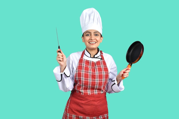 young happy chef girl white outfit having tools indian pakistani mode