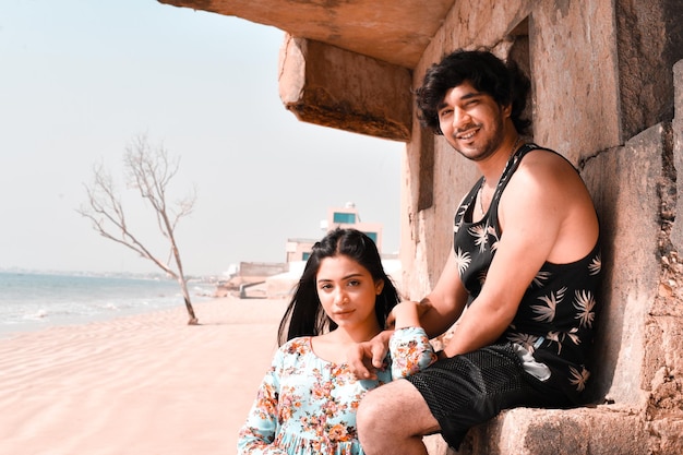 young happy couple at beach indian pakistani model