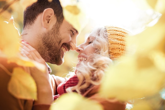 Young happy couple have fun in the park