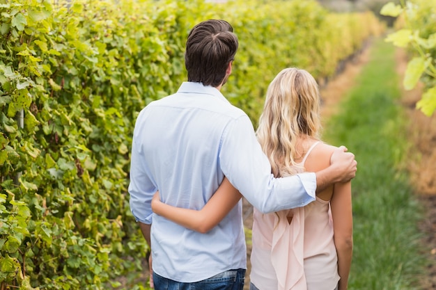 Young happy couple having an arm around each other