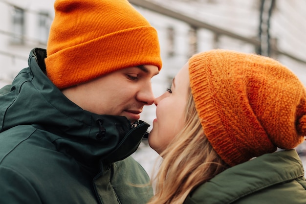young happy couple having fun together at a christmas market