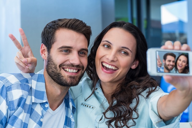 Young happy couple making a selfie