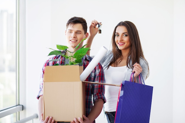 Young happy couple moving into their new home.