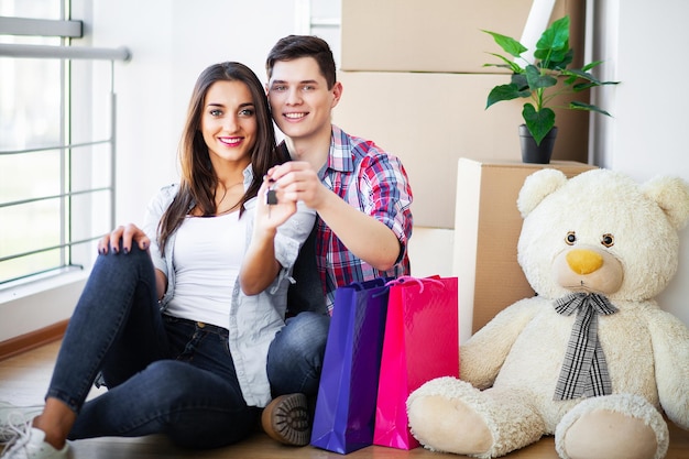 Young happy couple moving into their new home