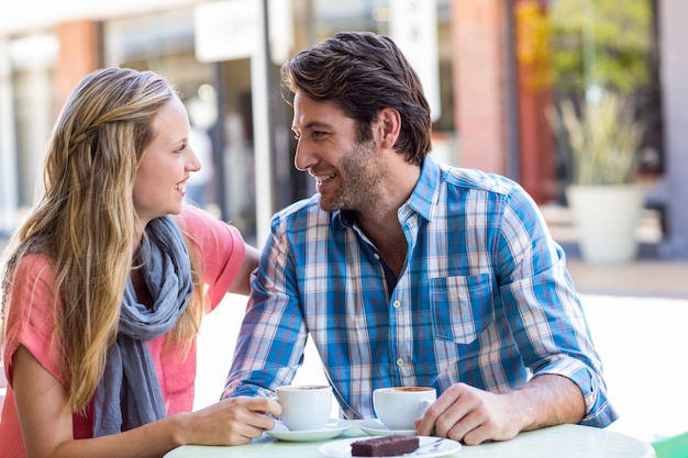  Young happy couple smiling at each other