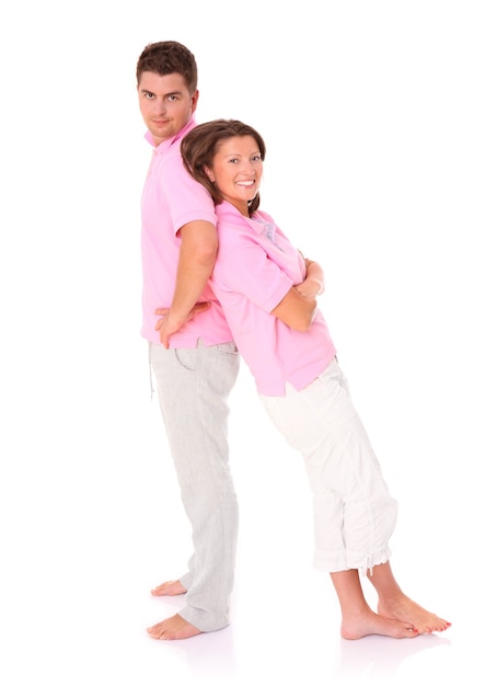 a young happy couple standing over white