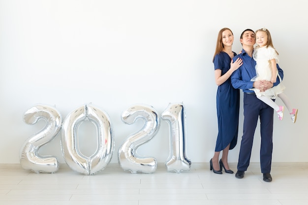 Young happy family celebrating new years eve