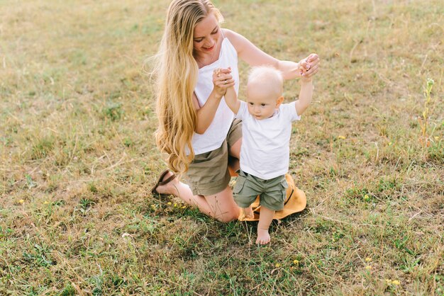 a young happy family in the field have a fun