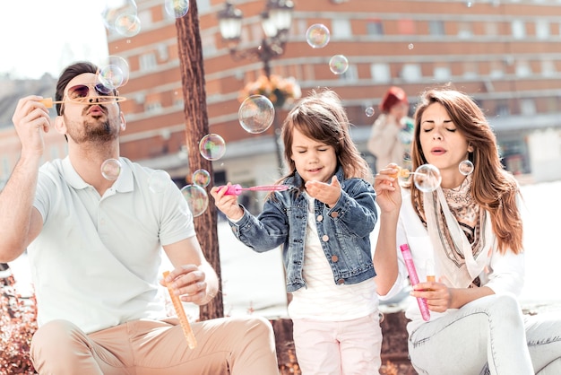 Young happy family having fun together outdoor