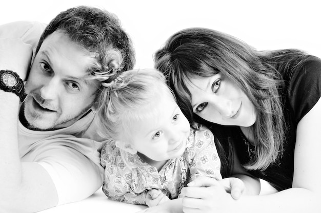 Photo young happy family with beautiful baby playing and smile  isolated on white in studio