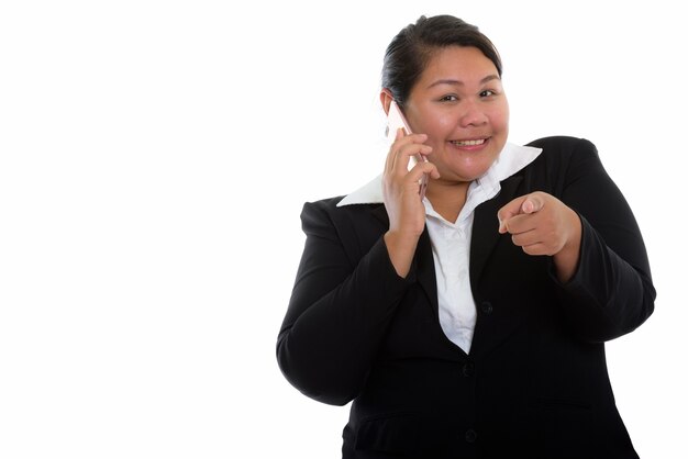 young happy fat Asian businesswoman smiling