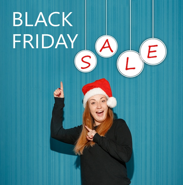 The young happy girl. Black Friday sale - holiday shopping concept