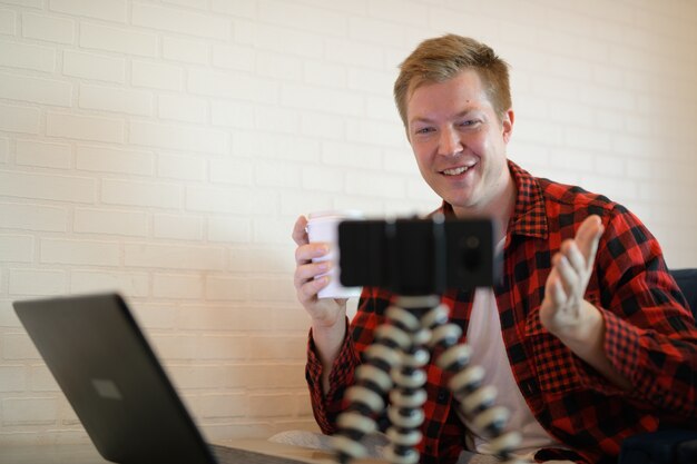 Young Happy Hipster Man Drinking Coffee