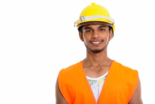 young happy Indian man construction worker smiling