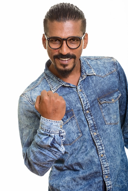 Young happy Indian man looking motivated