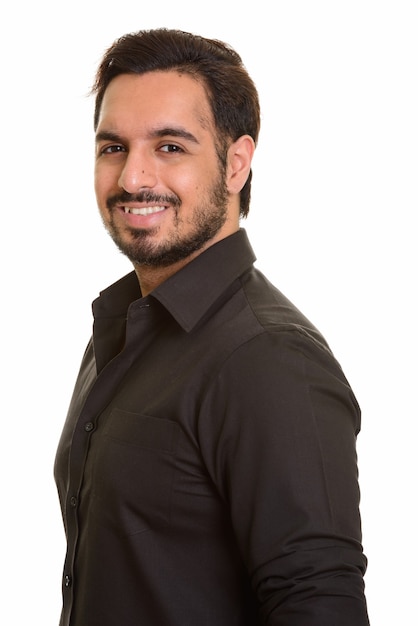 Young happy Indian man smiling and looking and posing