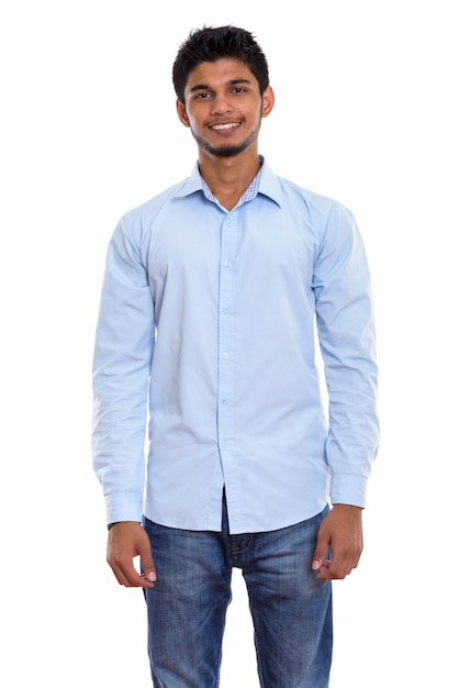 young happy Indian man smiling and standing