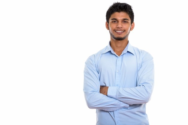 young happy Indian man smiling with arms crossed