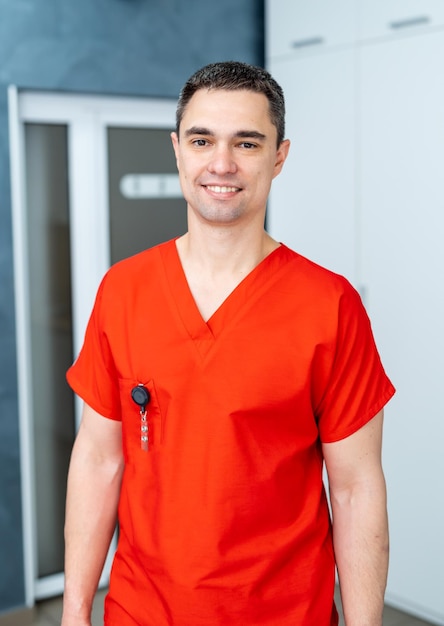 Young happy male medical doctor portrait in hospital Medical and health care concept