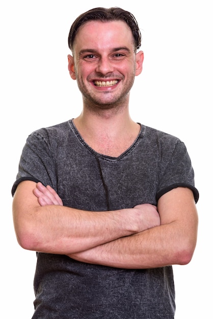 young happy man smiling with arms crossed