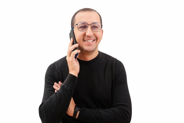 Young happy man with a phone in his hands on a white background