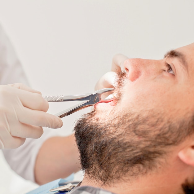 Young happy man and woman in a dental examination at dentist