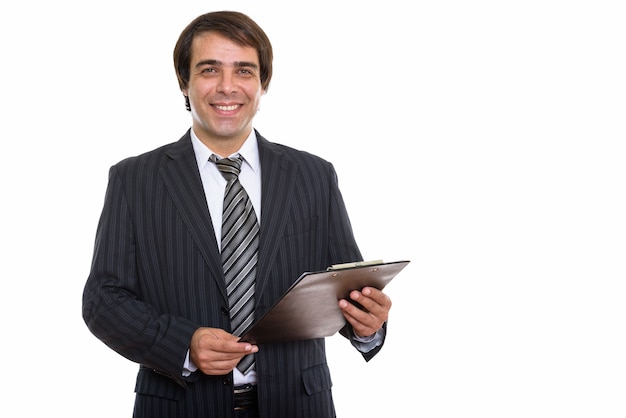 young happy Persian businessman smiling while holding clipboard